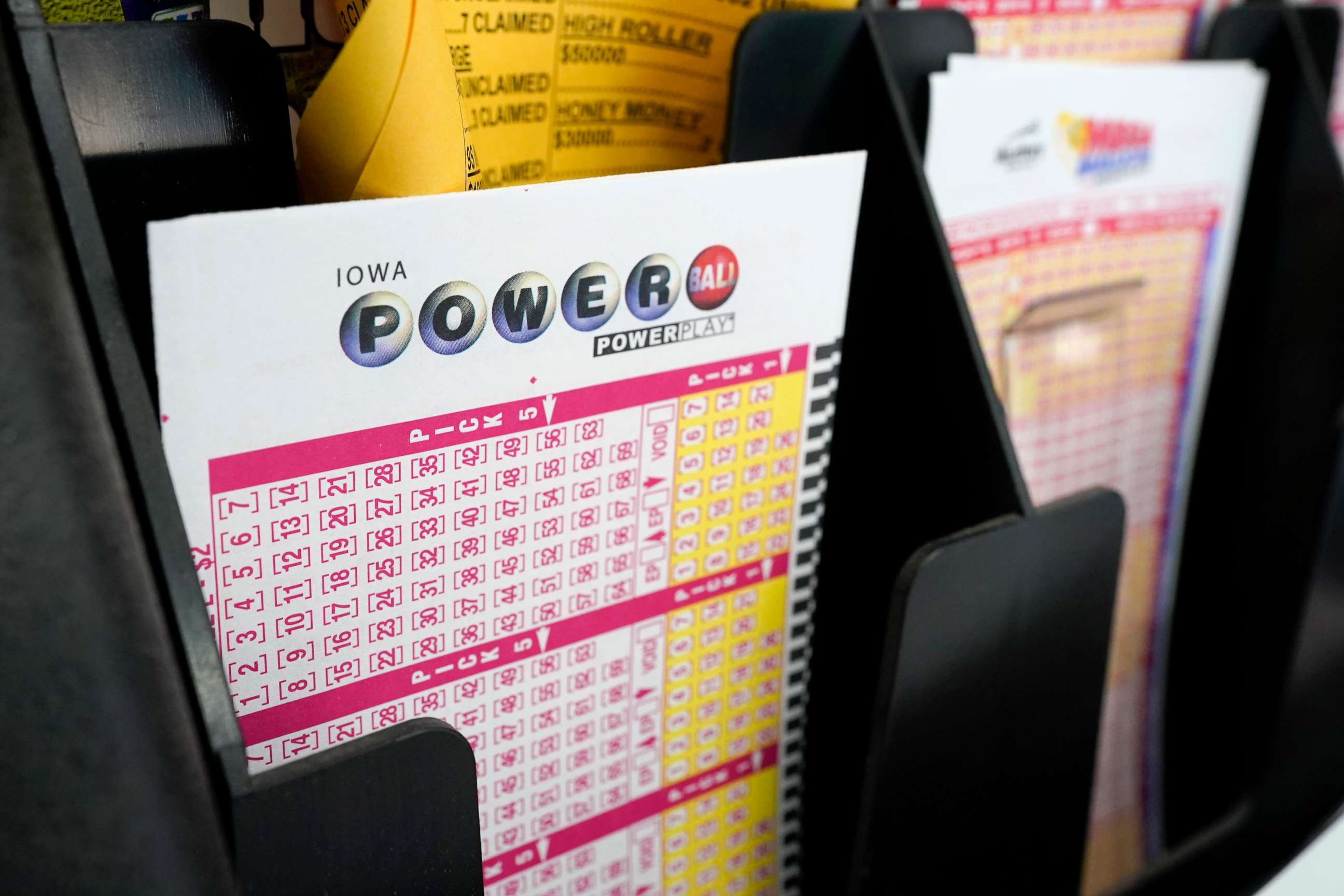 PHOTO: Blank forms for the Powerball lottery sit in a bin at a local grocery store, in Des Moines, Iowa, Jan. 12, 2021.