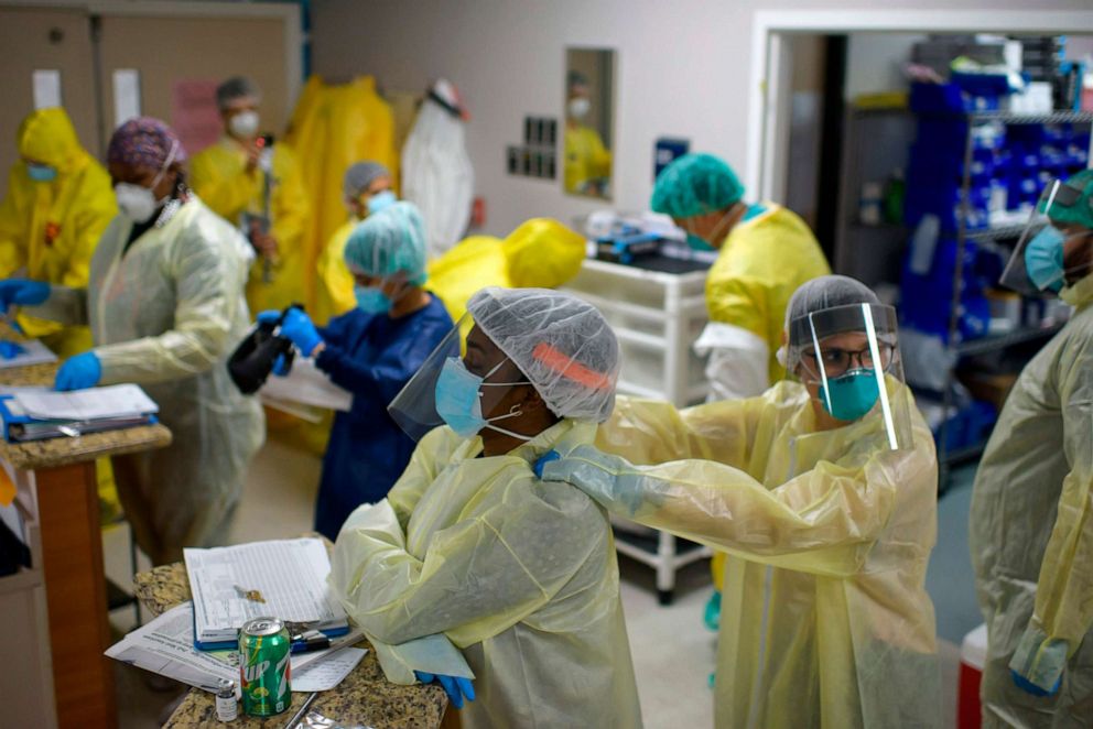 PHOTO: A healthcare worker gives another a shoulder rub before they go back into the the Covid-19 Unit at United Memorial Medical Center in Houston, Texas, July 2, 2020.