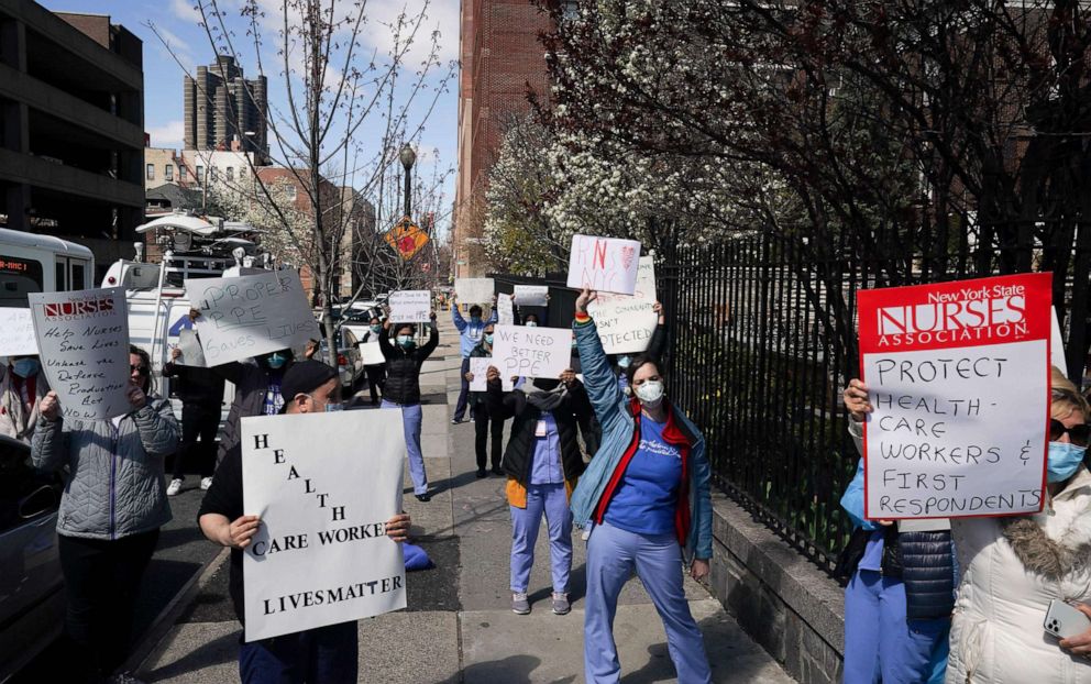 PHOTO: Members of the medical staff listen as Montefiore Medical Center nurses call for N95 masks and other critical PPE to handle the coronavirus (COVID-19) pandemic on April 1, 2020 in the Bronx neighborhood of New York.