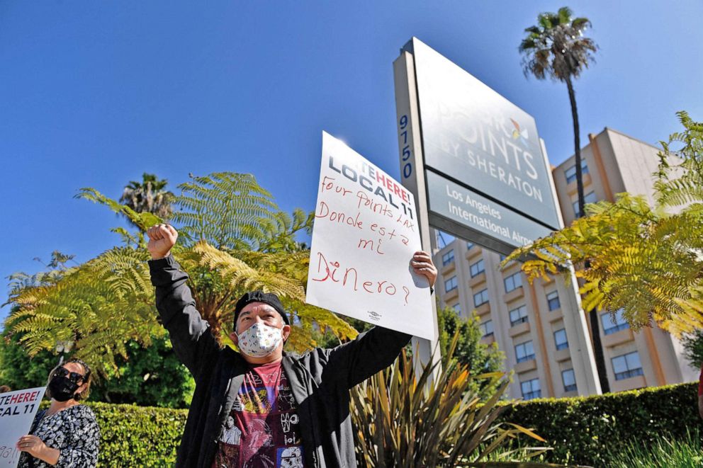 PHOTO: Laid-off employees and workers with Unite Here 11 protest outside the closed Four Points by Sheraton LAX hotel calling for an investigation by the US Small Business Administration (SBA) into the use of PPP loan funds in Los Angeles, April 7, 2021.