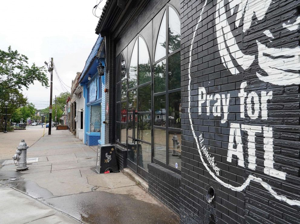 PHOTO: A sign that reads "Pray For Atlanta" is seen on the side of a restaurant in Atlanta, Georgia, on April 23, 2020.