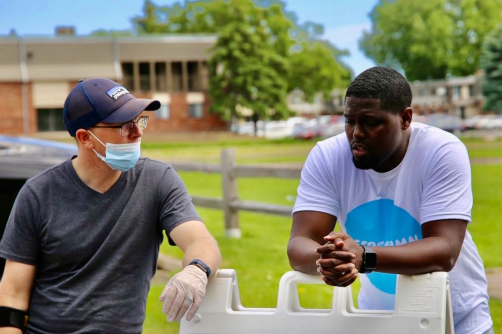 PHOTO: Pastor W. Seth Martin speaks with a member of his congregation at a community service event on June 6, 2020.