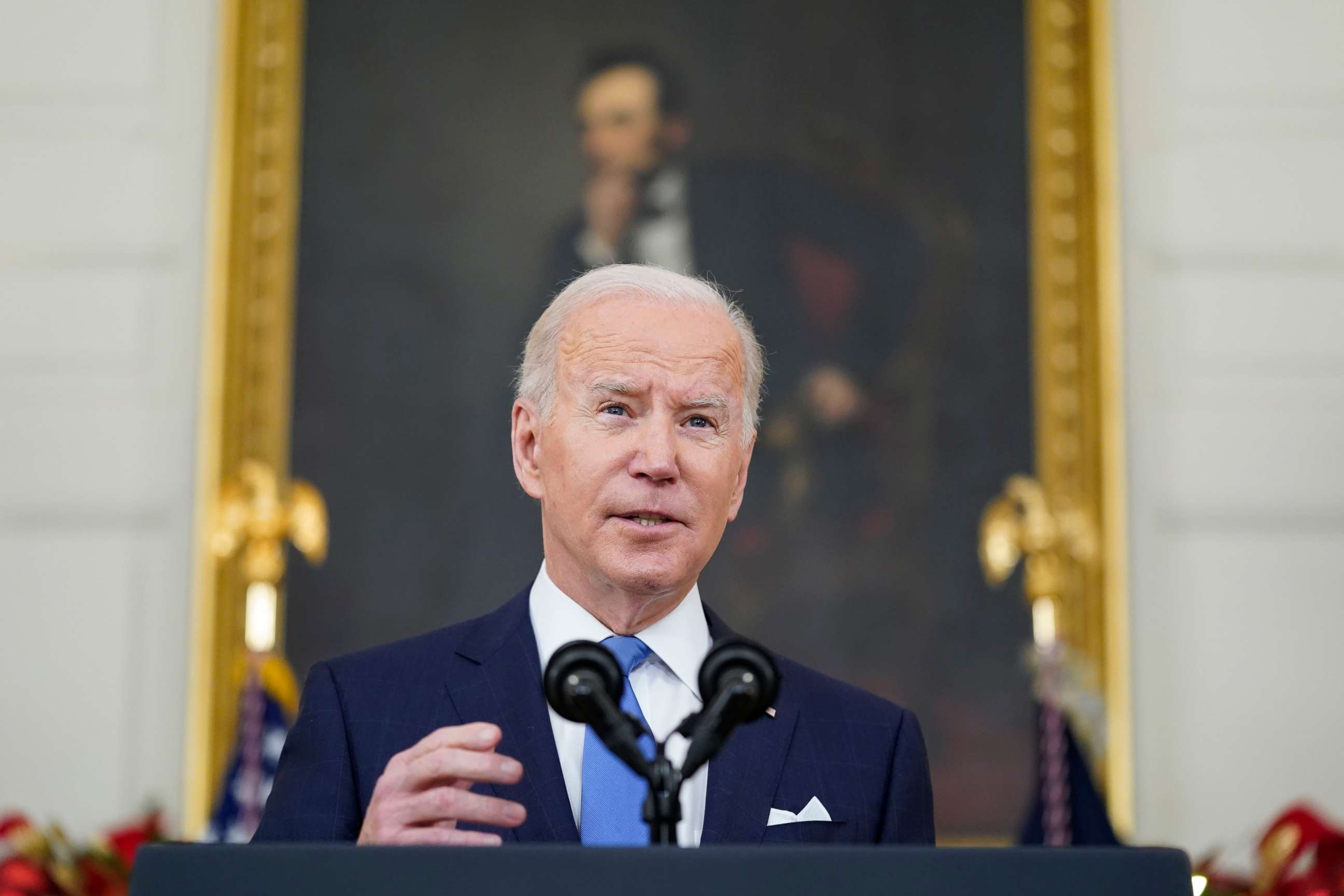 PHOTO: President Joe Biden speaks about the COVID-19 response and vaccinations, Dec. 21, 2021, in the State Dining Room of the White House in Washington.