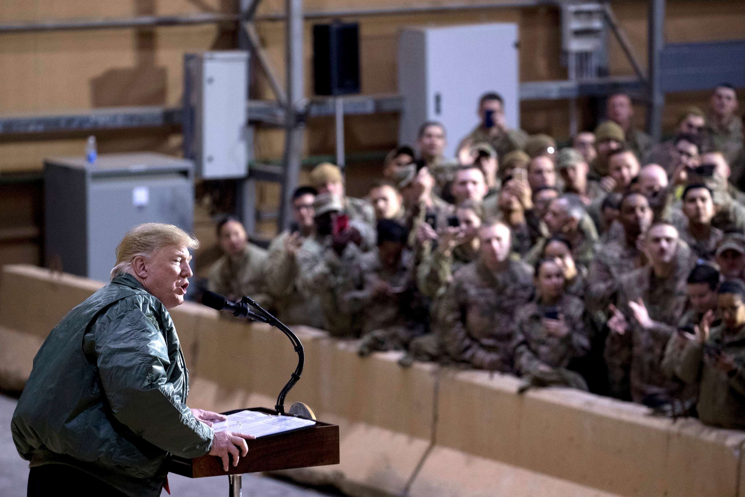 PHOTO: President Donald Trump speaks at a hangar rally at Al Asad Air Base, Iraq, Dec. 26, 2018.