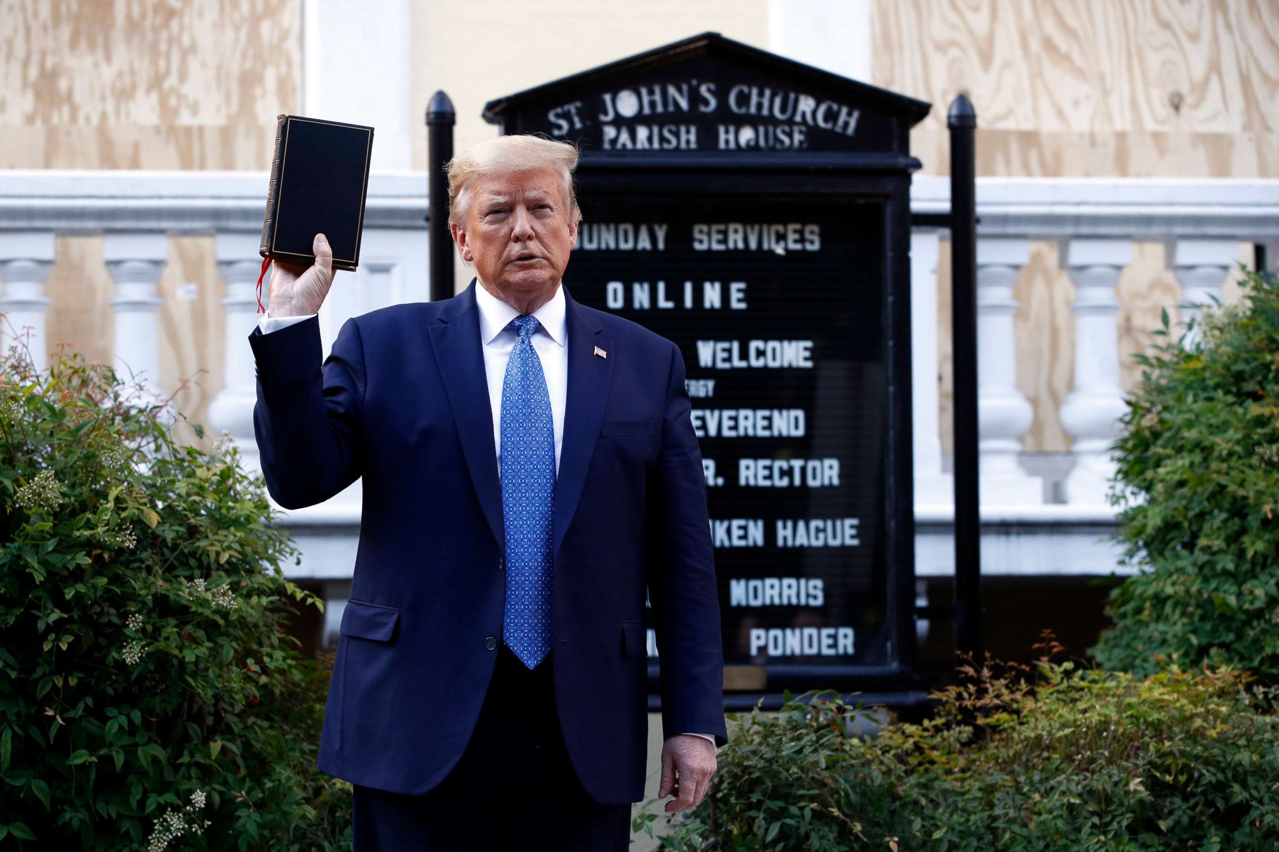 PHOTO: President Donald Trump holds a Bible as he visits outside St. John's Church across Lafayette Park from the White House, June 1, 2020, in Washington.