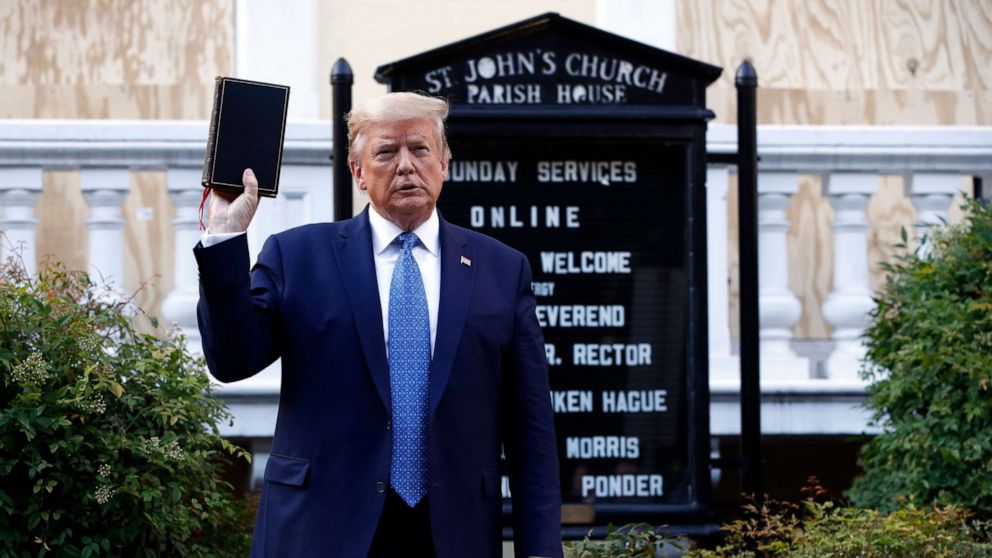 PHOTO: President Donald Trump holds a Bible as he visits outside St. John's Church across Lafayette Park from the White House, June 1, 2020, in Washington.