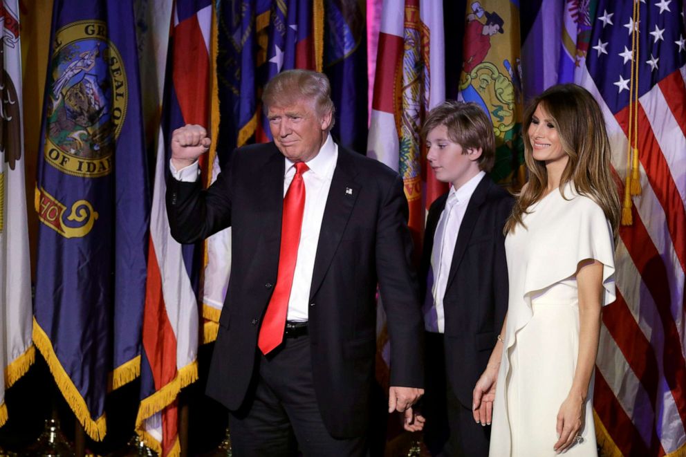 PHOTO: President-elect Donald Trump pumps his fist after giving his acceptance speech as his wife Melania Trump, right, and their son Barron Trump follow him during his election night rally, Nov. 9, 2016, in New York.