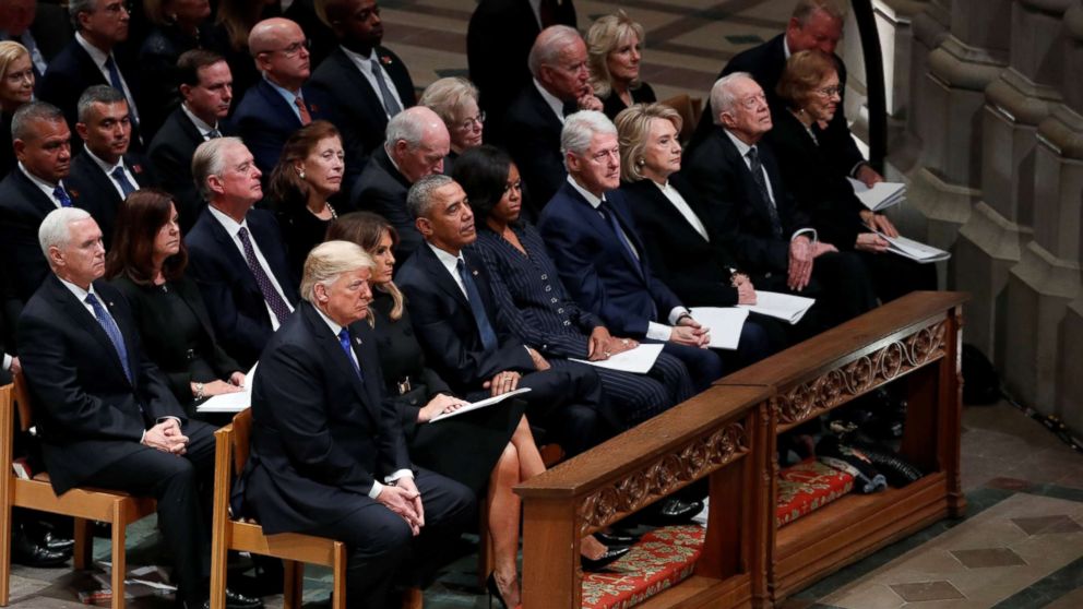 President Donald Trump sits with first lady Melania Trump, former President Barack Obama, former first lady Michelle Obama, former President Bill Clinton and former first lady Hillary Clinton, former President Jimmy Carter and first lady Rosalynn Carter in the front row at the state funeral for former President George H.W. Bush at the Washington National Cathedral in Washington, Dec. 5, 2018.