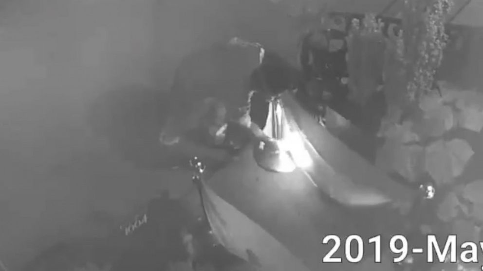 PHOTO: An image made from video released by the NYPD Crime Stoppers shows a person setting fire to two rainbow pride flags in front of the Alibi Lounge in the Harlem borough of New York, May 31, 2019.