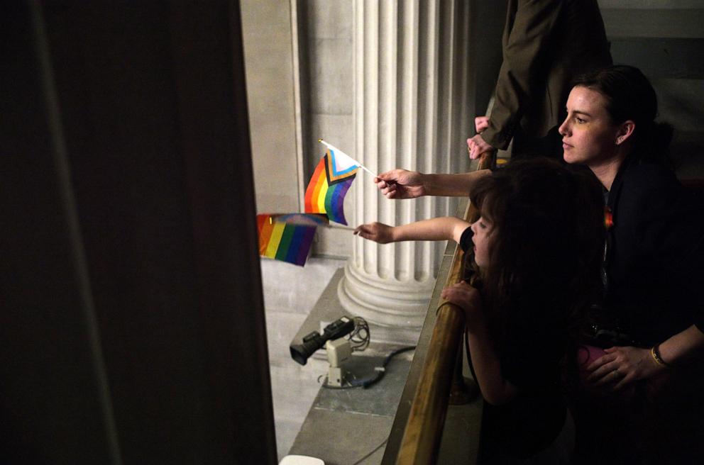 PHOTO: In this Feb. 26, 2024, file photo, a woman and her daughter wave Pride flags from the East Balcony of the Tennessee House during debate of HB 1605, banning pride flags in Tennessee Public Schools, at the Tennessee State Capitol in Nashville, Tenn.
