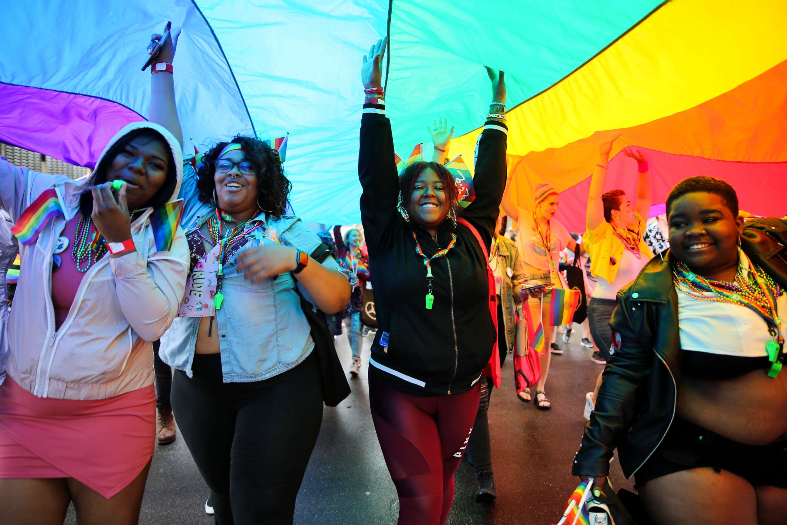 PHOTO: Participants with rainbow flag during the Motor City Pride Parade at Detroit, Michigan, June 10, 2018.