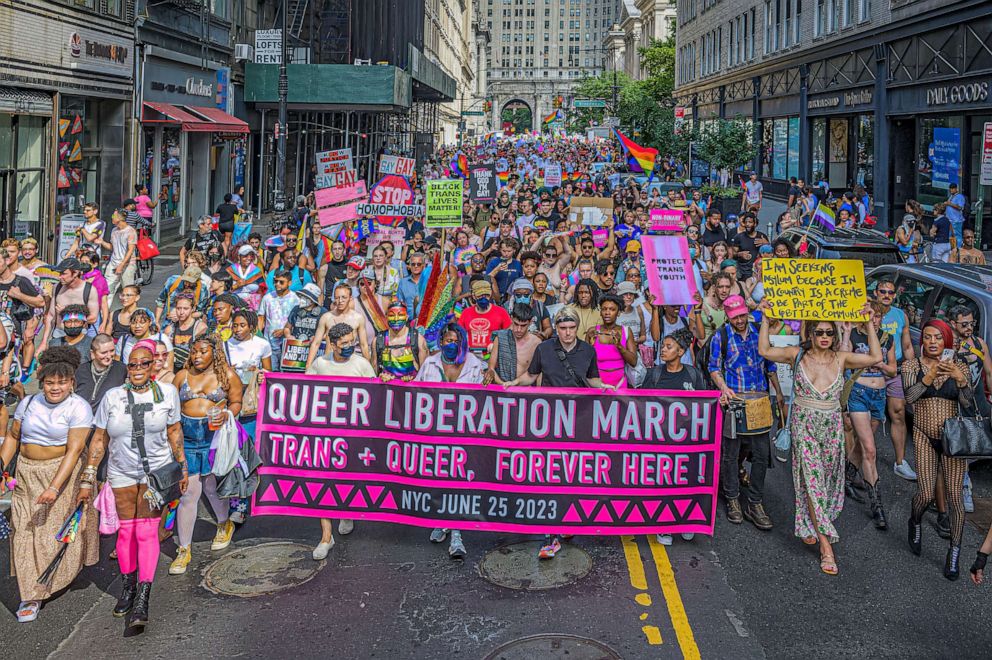 PHOTO: Participants are seen holding a banner at the Pride Parade March, June 25, 2023.