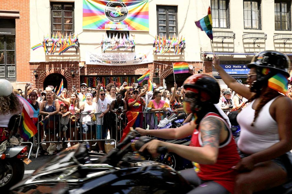 PHOTO: People on motorcycles make their way past the Stonewall Inn during the annual New York Gay Pride Parade, one of the oldest and largest in the world, in the West Village of Manhattan, June 25, 2017, in New York City.