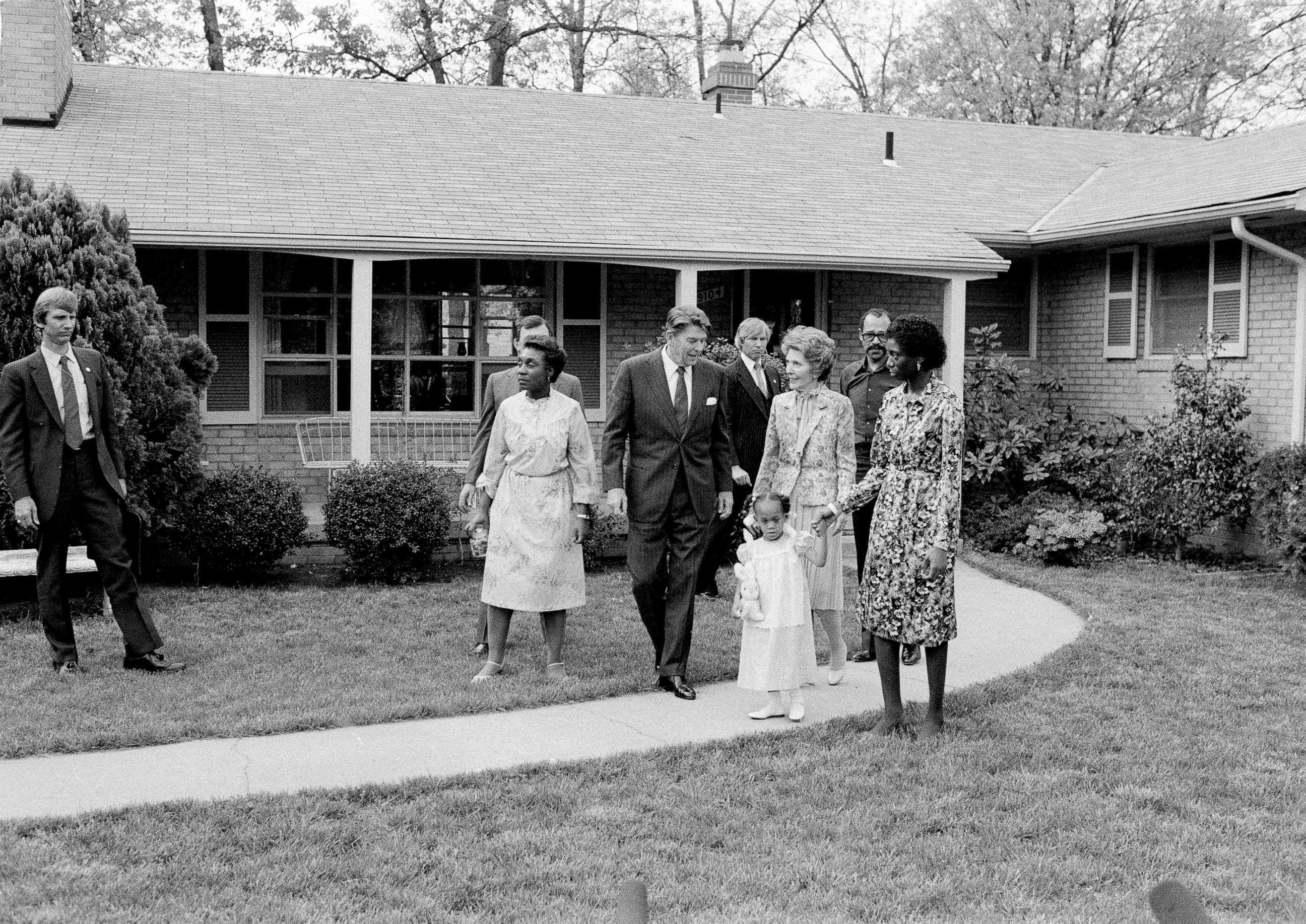 PHOTO: In this May 3, 1982 file photo, President Ronald Reagan and first lady Nancy Reagan walk with Barbara and Phillip Butler and their daughter Natasha, outside the family's home in College Park, Md., May 3, 1982.
