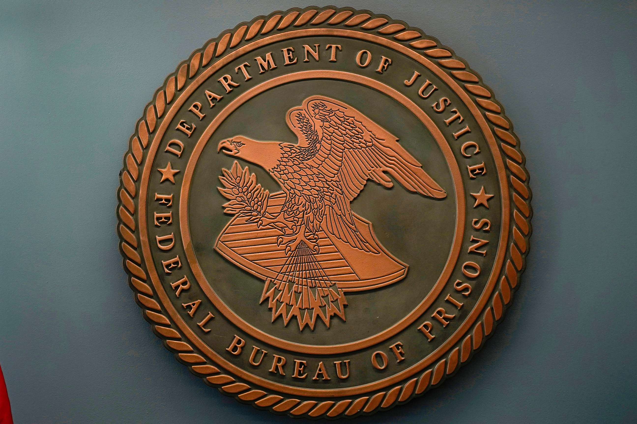 PHOTO: The seal for the Federal Bureau of Prisons is seen at Federal Bureau of Prisons headquarters in Washington, D.C., Oct. 24, 2022.