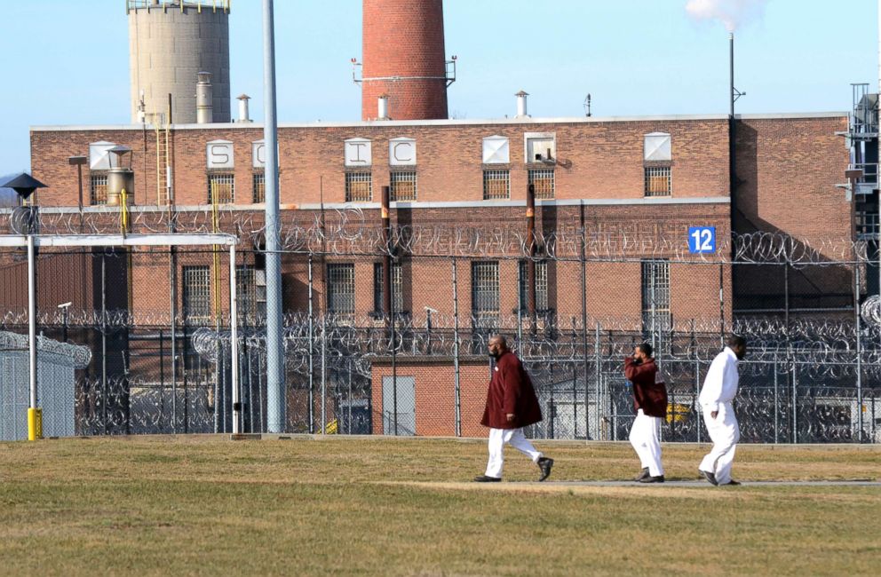 PHOTO: Inmates walk across a yard at the State Correctional Institution at Camp Hill, Jan. 13, 2017, in Camp Hill, Penn. 