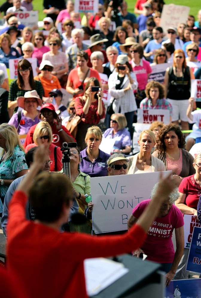 PHOTO: The crowd watches as Stephanie Kight, President and CEO of Planned Parenthood of Greater Ohio, speaks during the "We Won't Go Back" Statehouse Rally organized by more than 55 Ohio groups at the Ohio Statehouse, Oct. 2, 2013, in Columbus, Ohio.