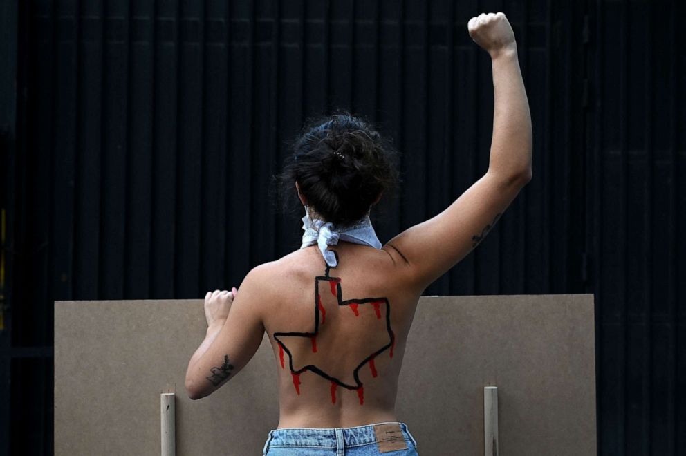 PHOTO: A Femen activist with the US state of Texas drawn on her back protests against the new abortion law in Texas in front of the US consulate in Madrid on Sept. 28, 2021.