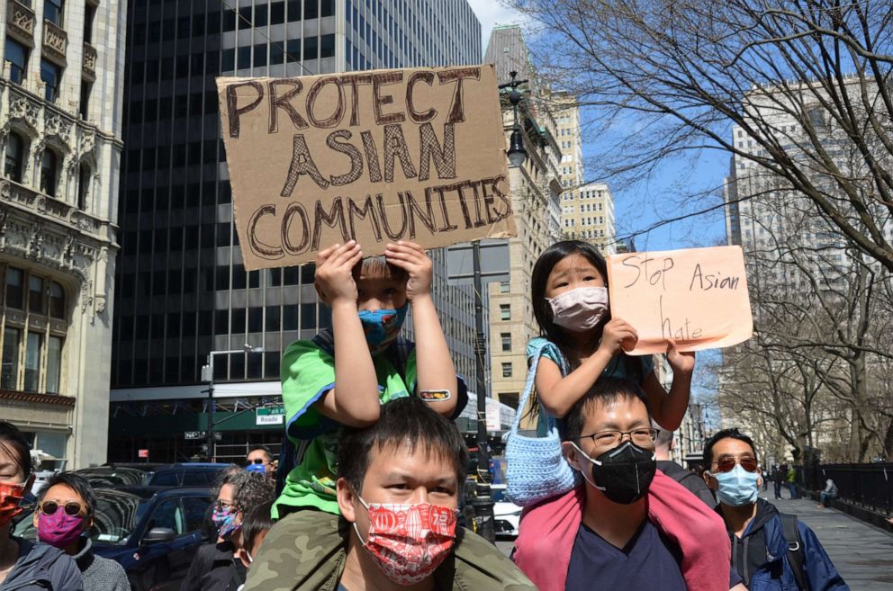 PHOTO: Young people hold signs near New York's City Hall during a "Stop Asian Hate" demonstration to show support to Asian community in New York, March 27, 2021, shortly after the Atlanta spa shootings.