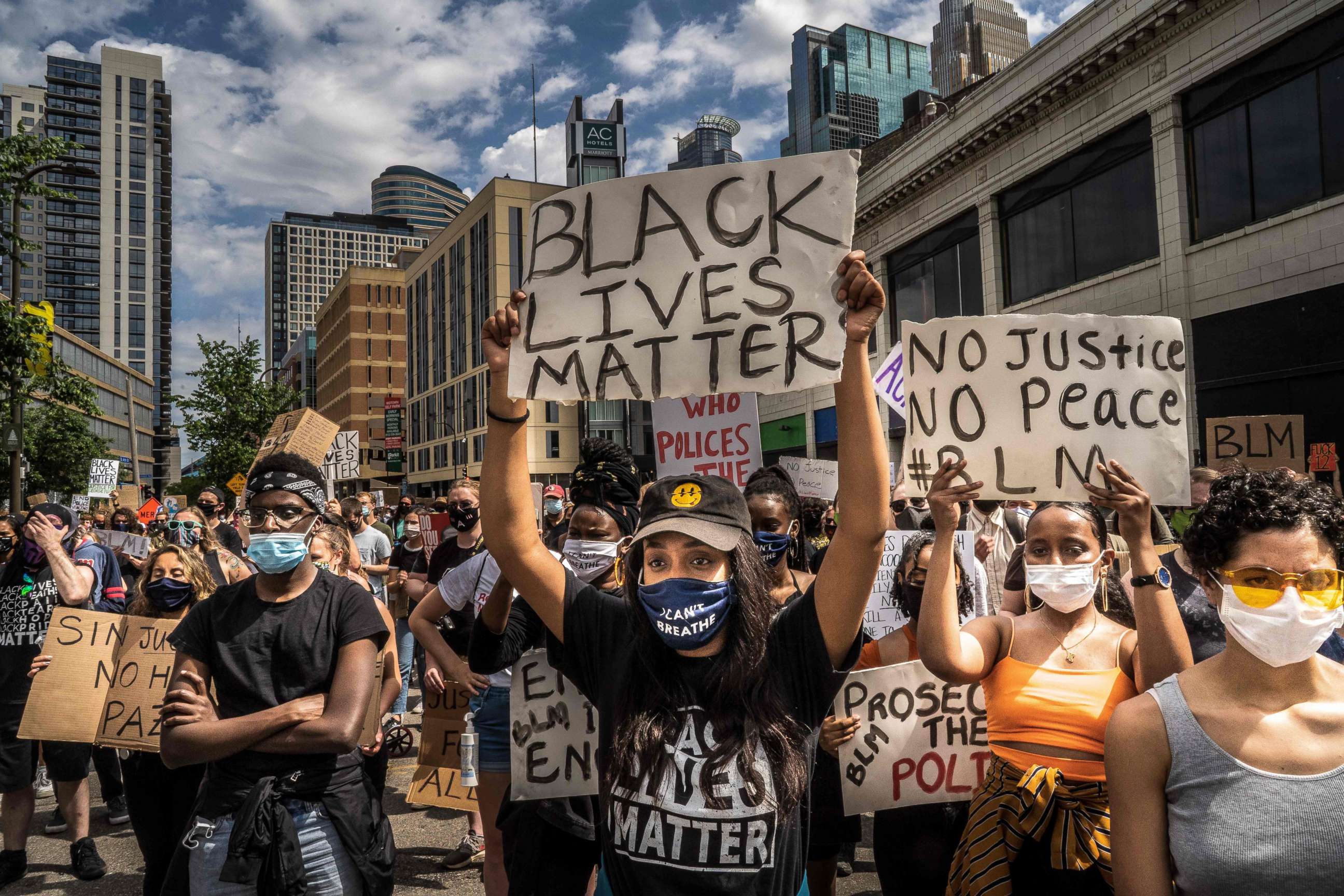 PHOTO: Protesters hold signs outside the Minneapolis 1st Police precinct during a demonstration against police brutality and racism on June 13, 2020 in Minneapolis, Minnesota.