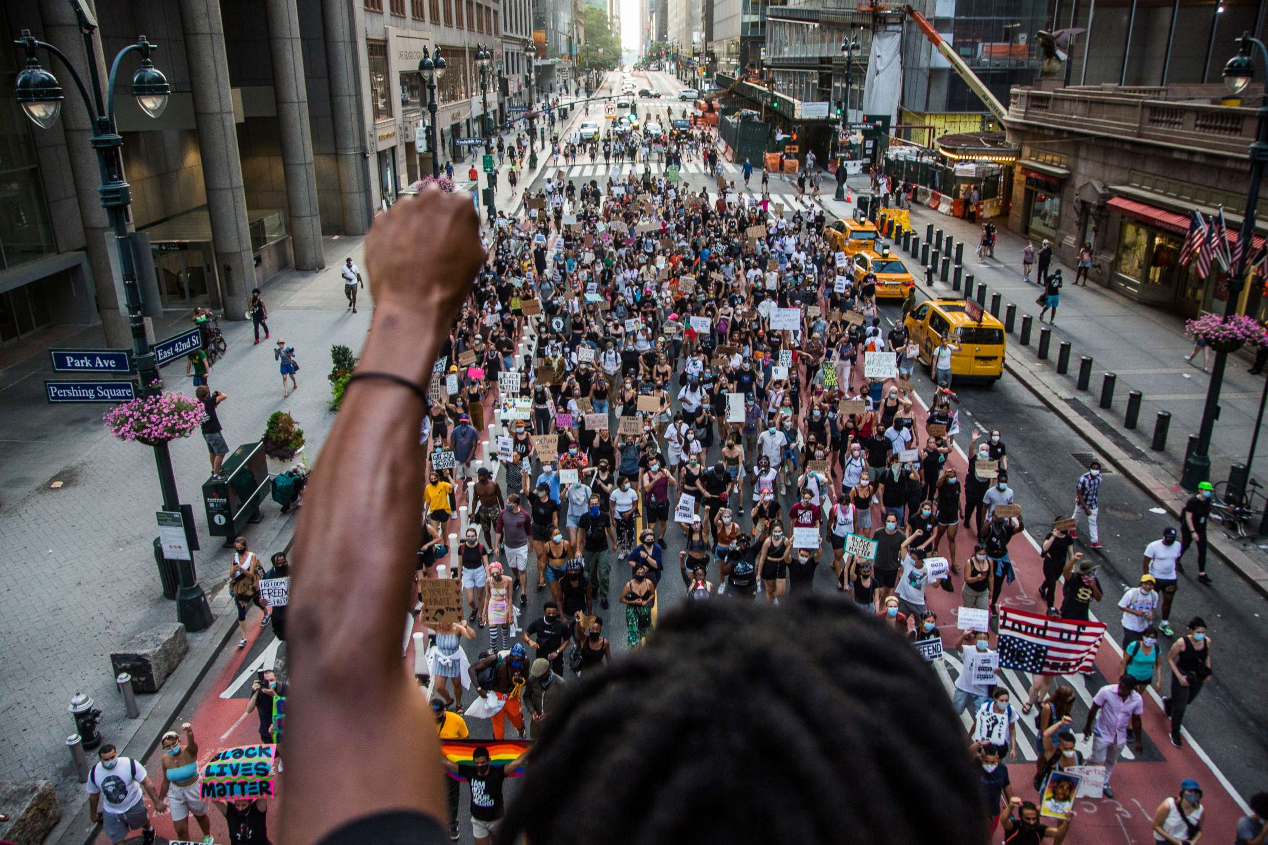 PHOTO: A man raises his arm in support of the crowd of protesters marching in downtown New York, on July 26, 2020.