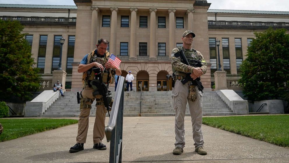 PHOTO: Members of the Three Percent Militia provide security for a "Patriot Day 2nd Amendment Rally" in support of gun rights at the State Capitol in Frankfort, Kentucky, U.S. May 24, 2020.