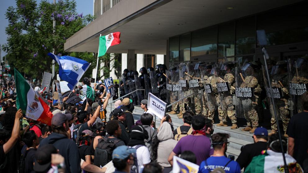 PHOTO: California National Guard troops keep watch, as protests against immigration sweeps continue, in Los Angeles, June 9, 2025.  
