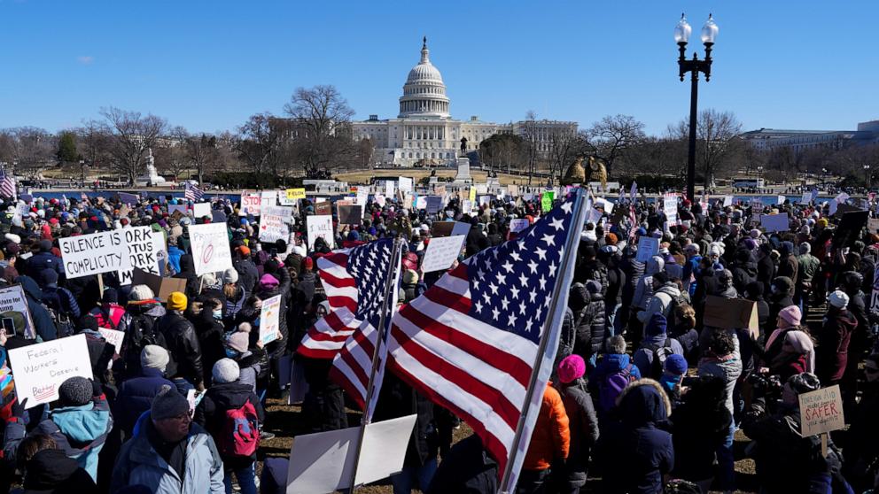 PHOTO: People hold U.S. flags as they take part in a protest outside the Capitol on President's Day in Washington, Feb. 17, 2025. 