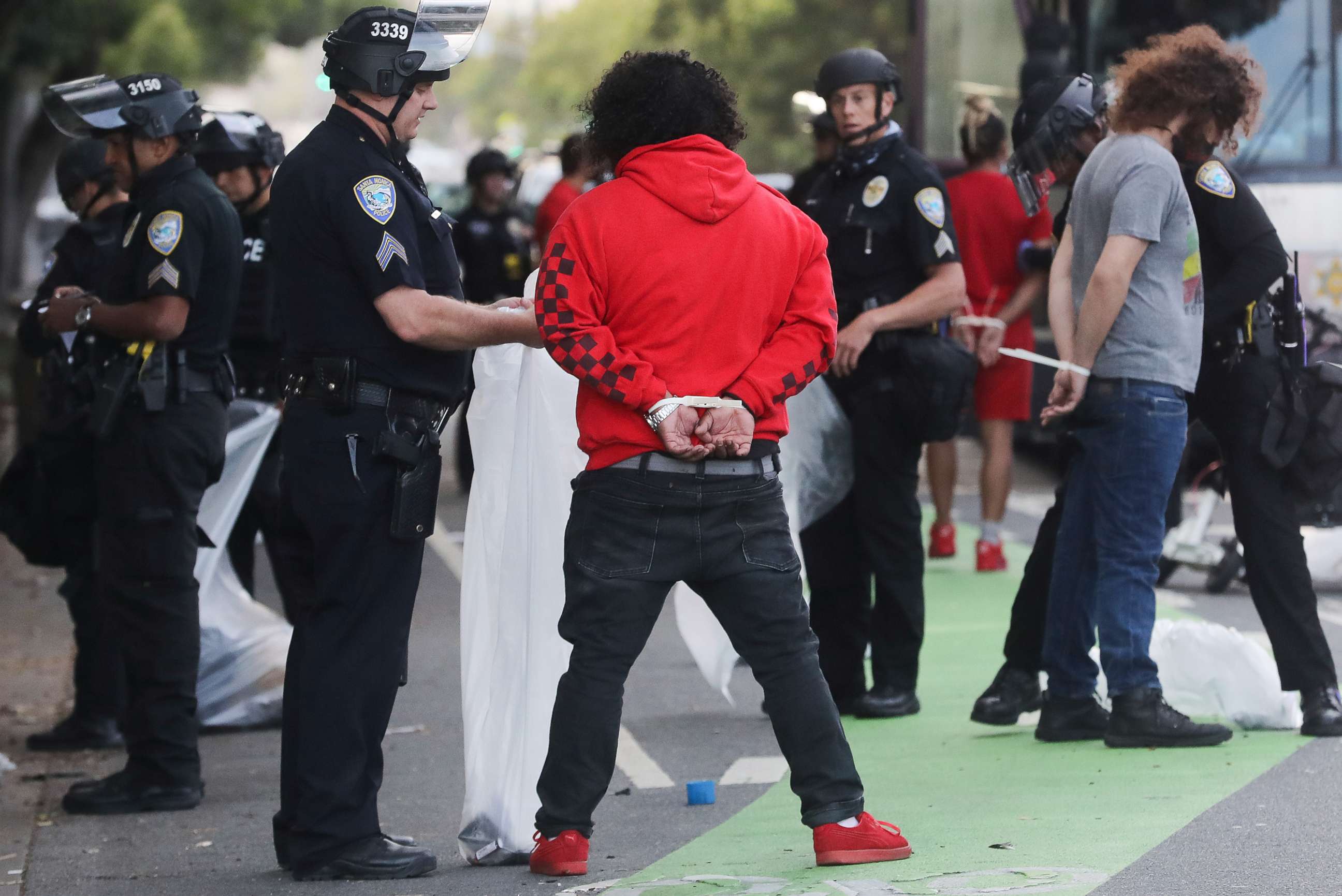 PHOTO: Police arrest people amid demonstrations and some ransacking in the aftermath of George Floyds death, May 31, 2020 in Santa Monica, California.