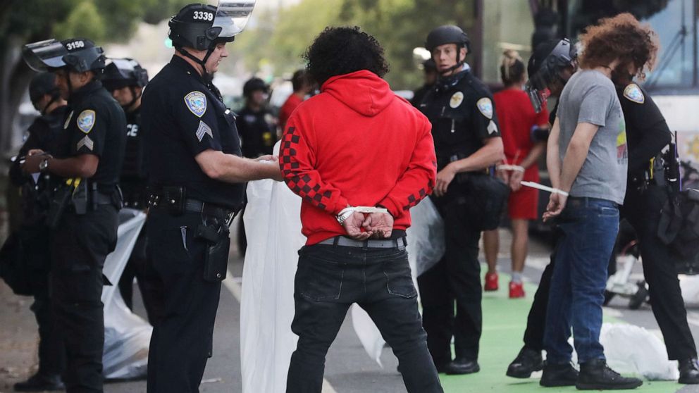 PHOTO: Police arrest people amid demonstrations and some ransacking in the aftermath of George Floyds death, May 31, 2020 in Santa Monica, California.