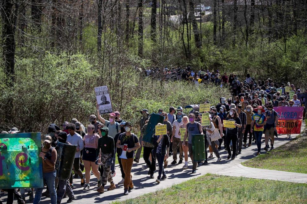 PHOTO: People protest against the building of a public safety training facility during a Defend the Atlanta Forest march on the South River Trail in Atlanta, Georgia, on March 4, 2023.