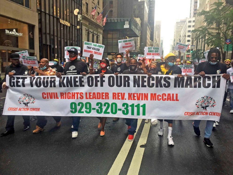 PHOTO: People walk during the  The "Get Your Knee Off Our Necks" march and demonstration protesting police brutality and racial inequality on July 31, 2020 in New York City.  