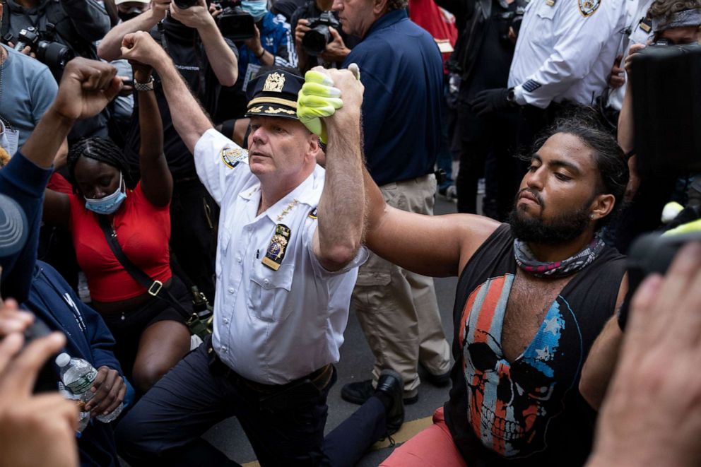 PHOTO: Chief of Department of the New York City Police, Terence Monahan, takes a knee with activists as protesters paused while walking in New York, June 1, 2020.