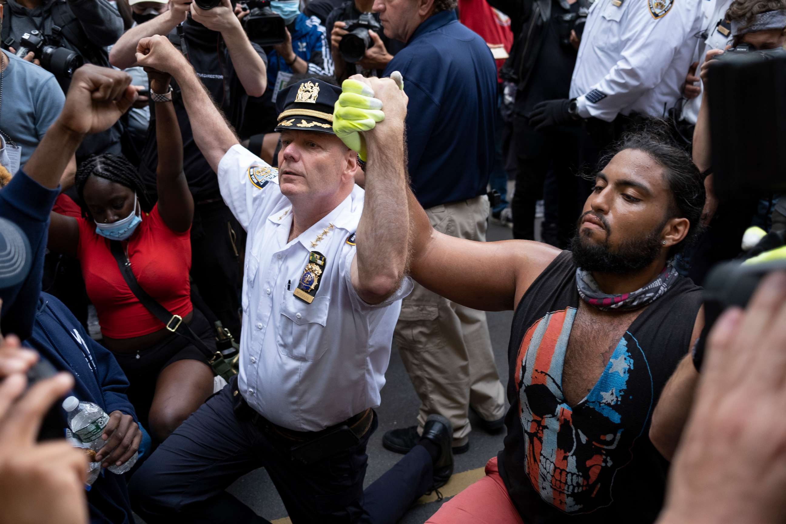 PHOTO: Chief of Department of the New York City Police, Terence Monahan, takes a knee with activists as protesters paused while walking in New York, June 1, 2020. 