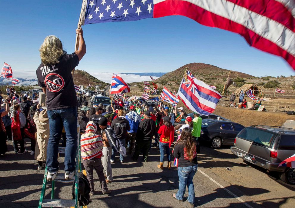 PHOTO: Protesters gather during the first of many blockades at the Mauna Kea visitors center to stopping construction vehicles heading to the site of the Thirty Mile Telescope on Mauna Kea in Hawaii, June 24, 2015.