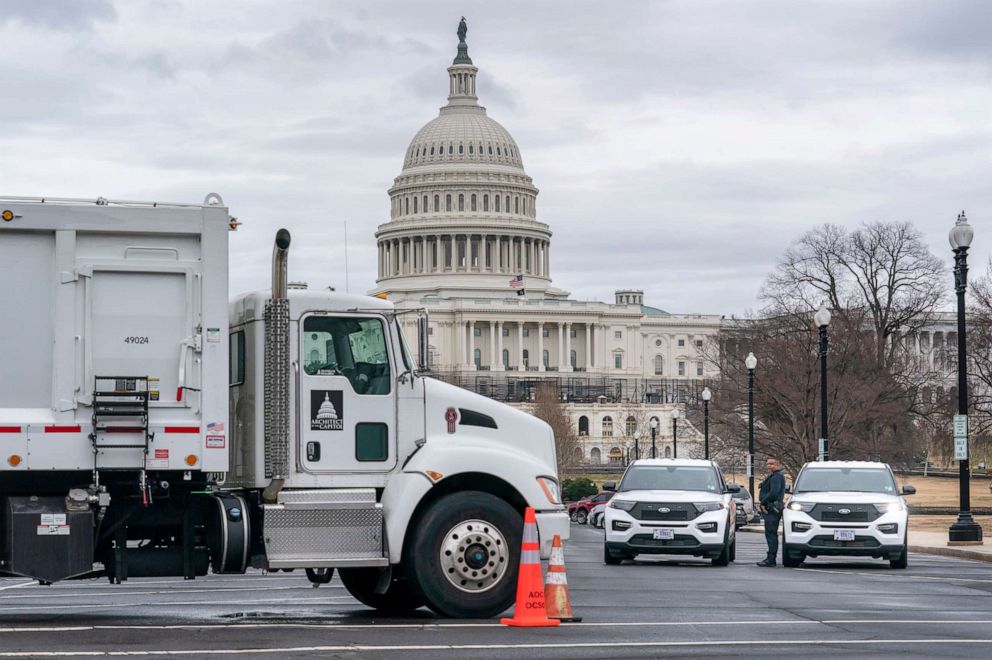 PHOTO: Heavy vehicles, including garbage trucks and snow plows, are set near the entrance to Capitol Hill in Washington, Feb. 22, 2022, amid reports of a planned trucker protest.