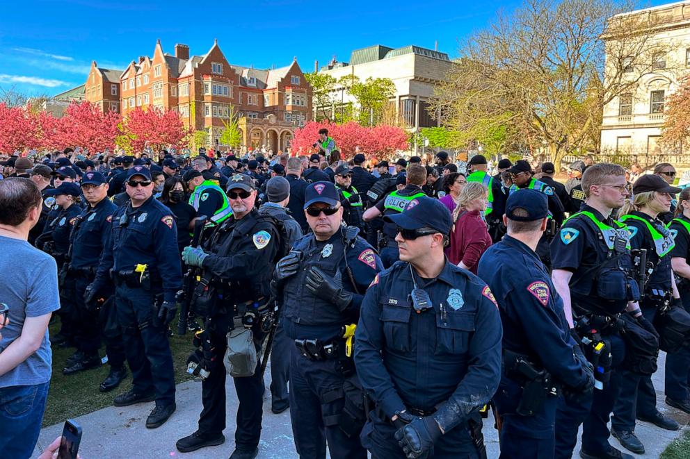 PHOTO: Police gather as they start removing tents erected by protesters from the campus of University of Wisconsin in Madison on Wednesday, May 1, 2024 in Madison, Wis.