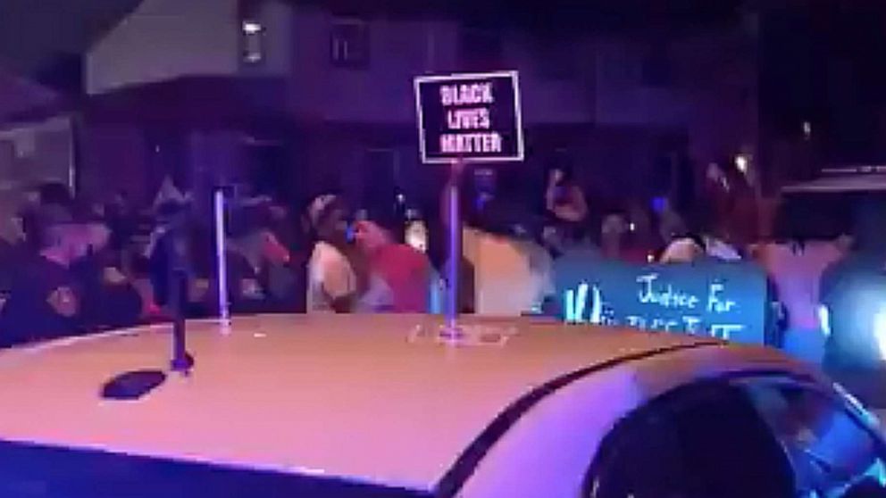 PHOTO: In this still image taken from a video, protesters gather near the site of an officer-involved shooting in Kenosha, Wisconsin, on Aug. 23, 2020.