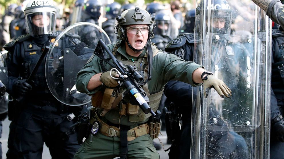 PHOTO: Police begin to clear demonstrators gather as they protest the death of George Floyd, Monday, June 1, 2020, near the White House in Washington.