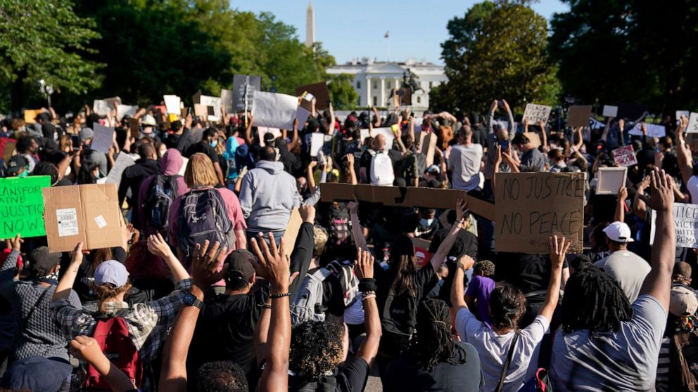 PHOTO: Demonstrators gather to protest the death of George Floyd, Monday, June 1, 2020, near the White House in Washington.