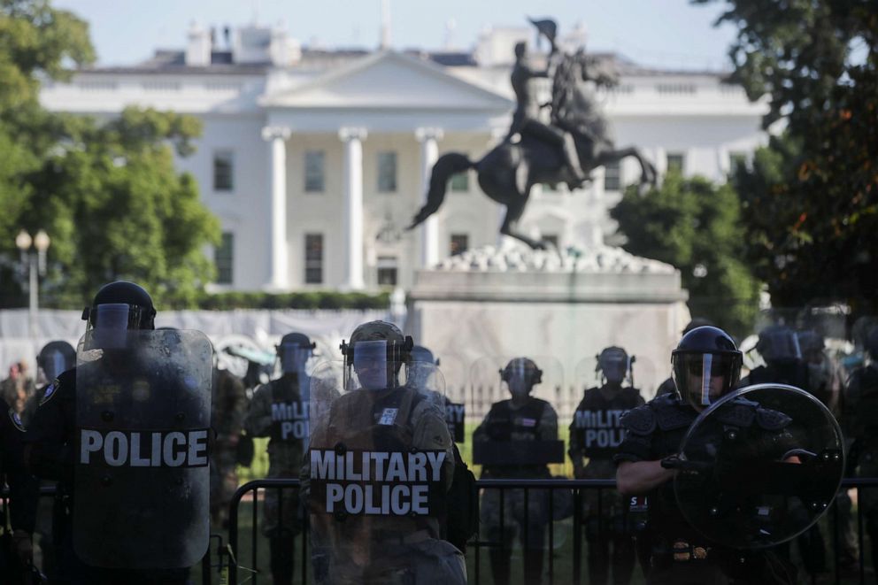 PHOTO: DC National Guard military police officers look on as demonstrators rally near the White House against the death in Minneapolis police custody of George Floyd, in Washington, D.C., June 1, 2020.