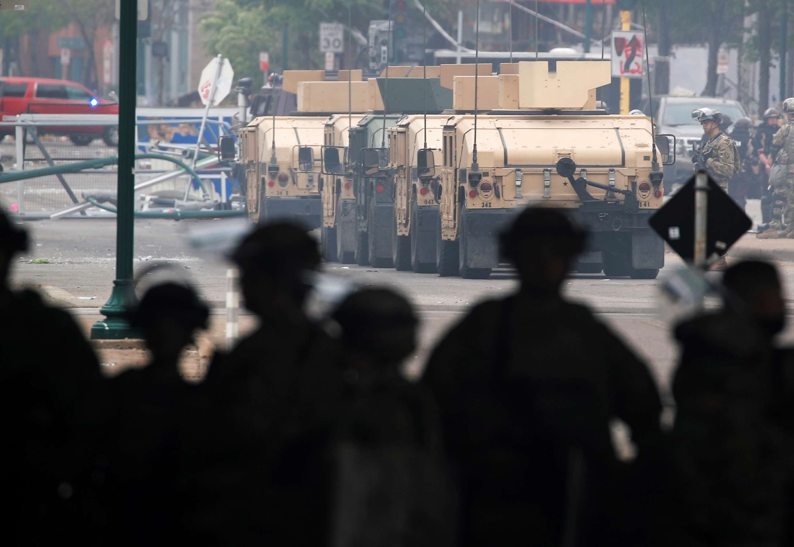 PHOTO: Armored vehicles line the street as National Guard members guard the area in the aftermath the third night of violent protests, May 29, 2020, in Minneapolis, over the death of  George Floyd.