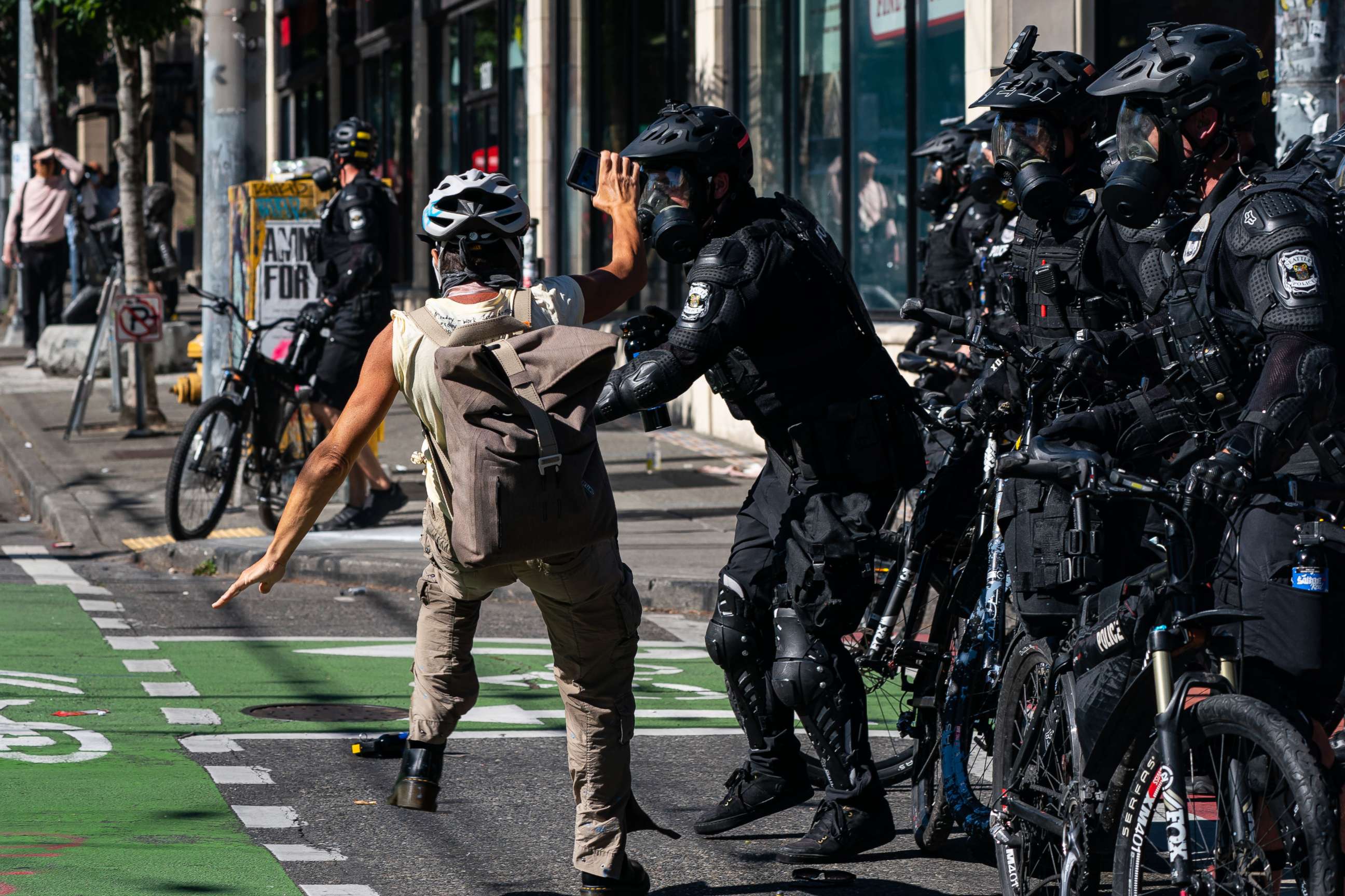 PHOTO: Police push a demonstrator to the ground during protests in Seattle, July 25, 2020.