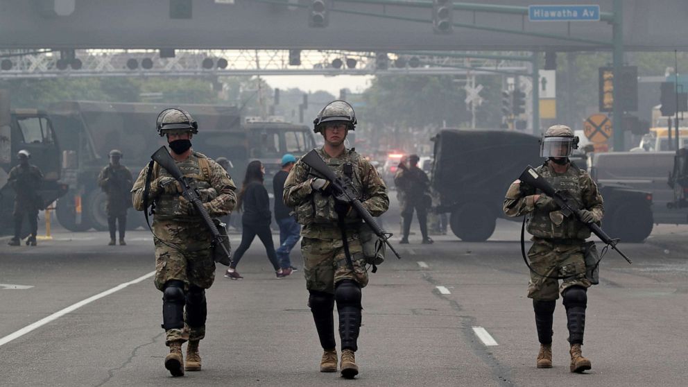 PHOTO: National Guard members patrol the protest area in Minneapolis, May 29, 2020, after three days of violent protests over the death of George Floyd.