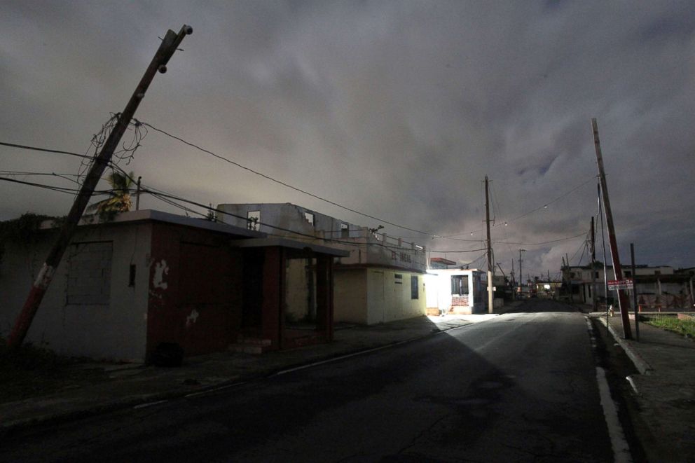 PHOTO: A house is lit with the help of a generator, on a street in the dark after Hurricane Maria damaged the electrical grid in September 2017, in Naguabo, Puerto Rico, January 25, 2018.
