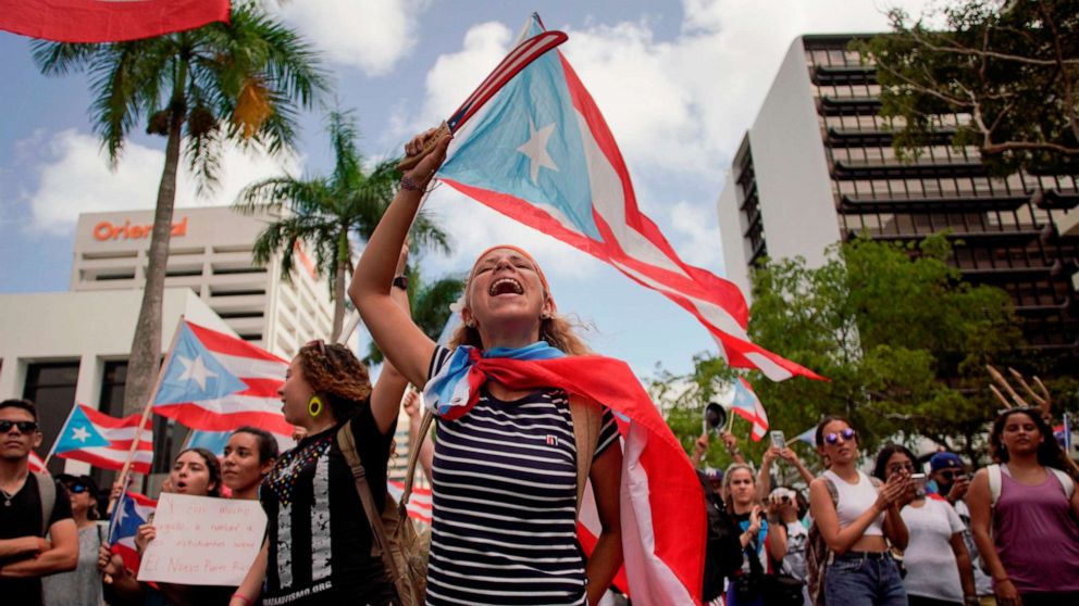 PHOTO: People march in San Juan, July 25, 2019, one day after the resignation of Puerto Rico Governor Ricardo Rossello. 