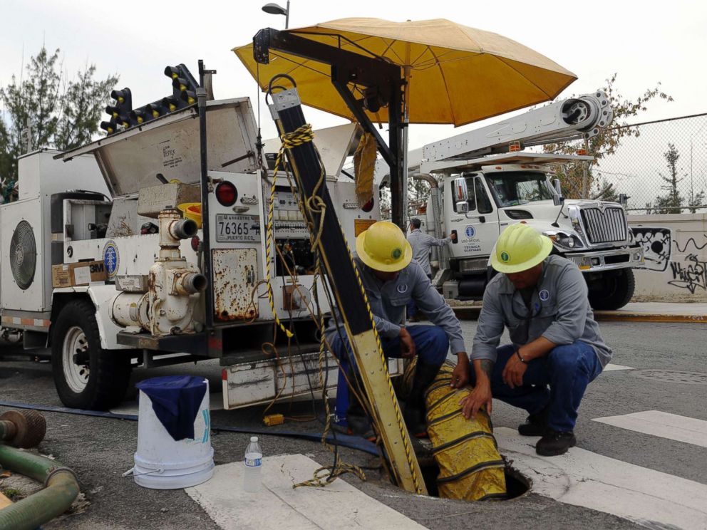 PHOTO: Employees of the Electric Power Authority of Puerto Rico take advantage of a general blackout to repair a damaged line in San Juan, Puerto Rico, April 18, 2018.