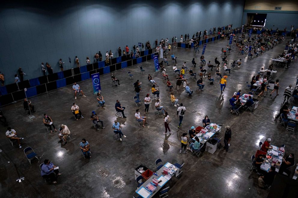PHOTO: People attend the first mass vaccination event to get inoculated with the Johnson and Johnson Covid-19 vaccine at the Puerto Rico Convention Center in San Juan, Puerto Rico, March 31, 2021.