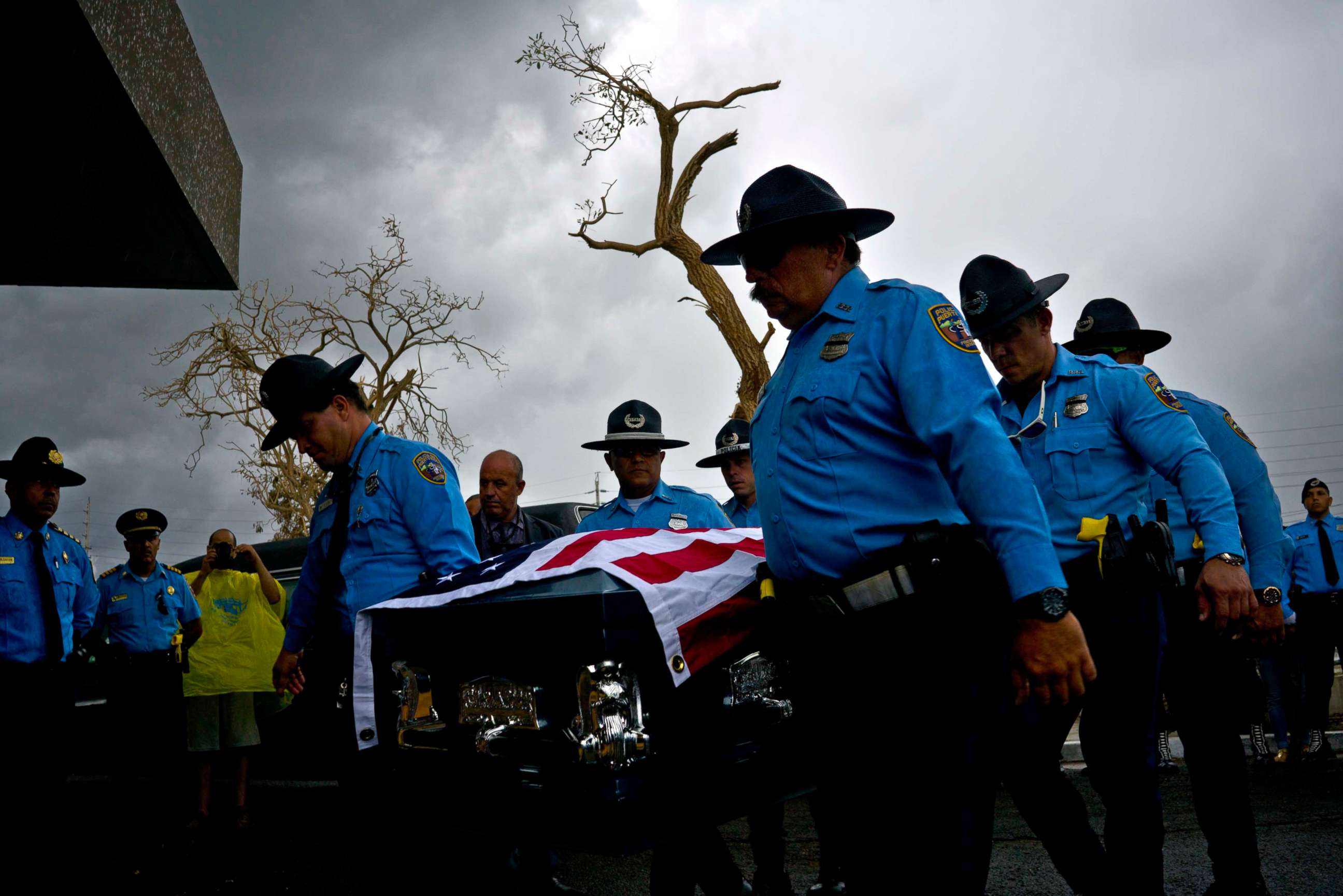 PHOTO: Honor guards carry the coffin of policeman Luis Angel Gonzalez Lorenzo, killed during Hurricane Maria when he tried to cross a river by car, during his funeral at the cemetery in Aguada, Puerto Rico, Sept. 29, 2017.