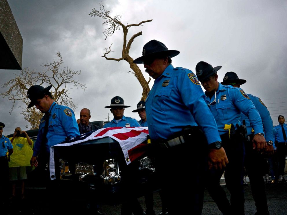 PHOTO: Honor guards carry the coffin of policeman Luis Angel Gonzalez Lorenzo, killed during Hurricane Maria when he tried to cross a river by car, during his funeral at the cemetery in Aguada, Puerto Rico, Sept. 29, 2017.